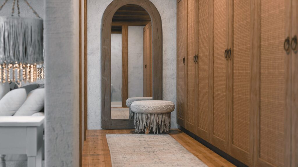 Arched doorway and timber wardrobe in a Serenity Villa bedroom