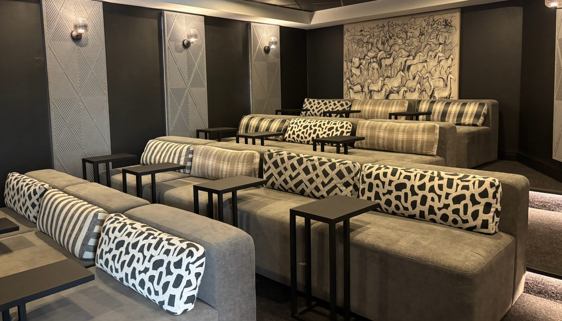 Screening room at The Ark with tiered banquette seating in patterned fabric